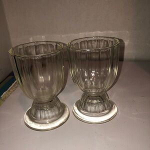 two vintage ribbed clear glass footed bowls/ glasses commonly used for ice cream